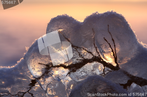 Image of Sunset over frozen lake