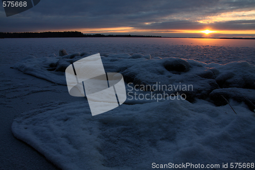 Image of Sunset over frozen lake