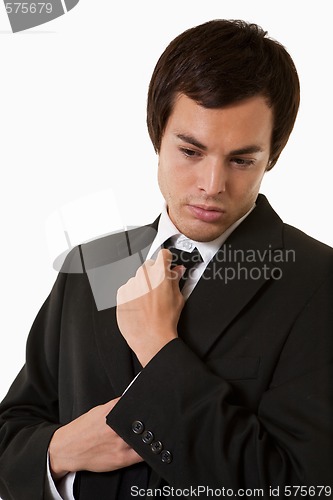 Image of Man fixing tie
