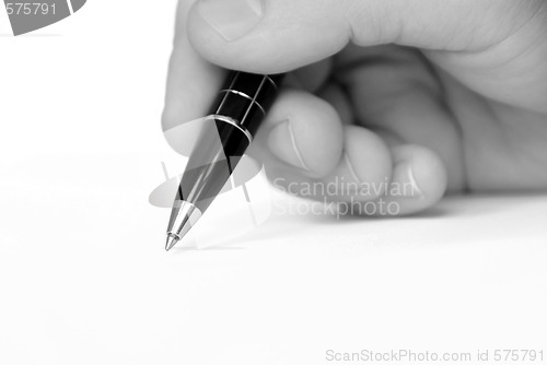 Image of Man hand writing on white paper