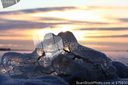 Image of Sunset over frozen lake