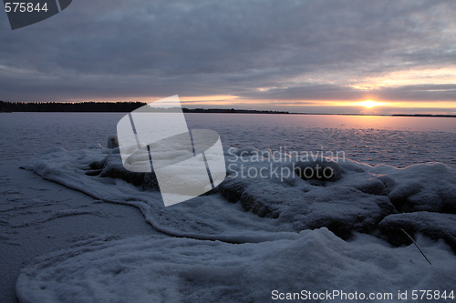 Image of Sunset over frozen lake