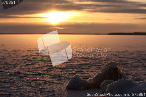 Image of Sunset over frozen lake