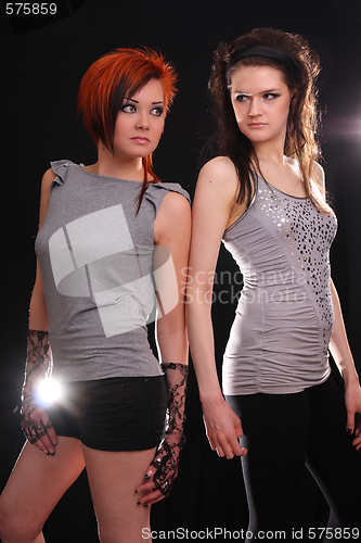 Image of Two models in colorful setting in the studio
