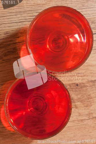 Image of Two glasses with jelly, oak floor