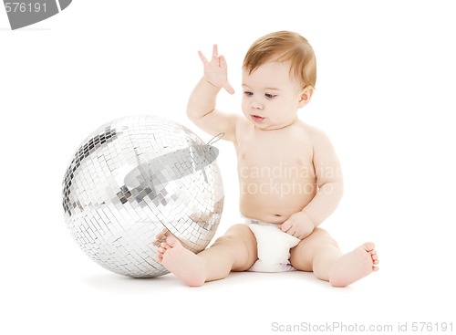 Image of adorable baby boy with big disco ball