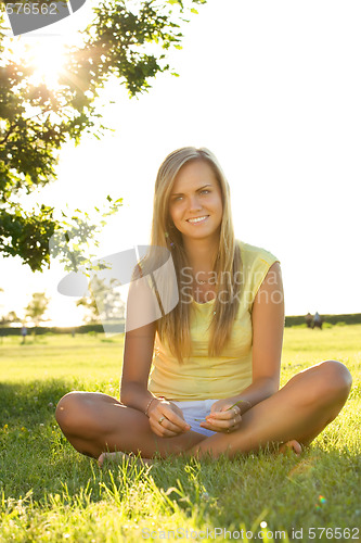 Image of sitting on grass