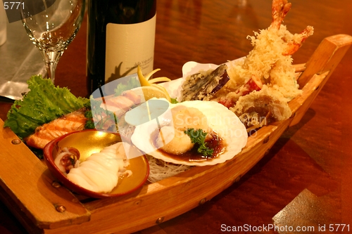 Image of Boat sushi with an assortment of delicacies.