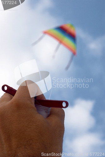 Image of Playing with a paper kite in the sky