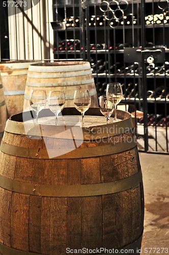 Image of Wine  glasses and barrels