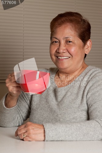 Image of Woman having coffee