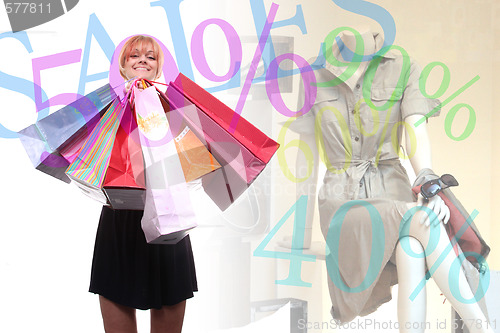 Image of happy young girl with colored bags