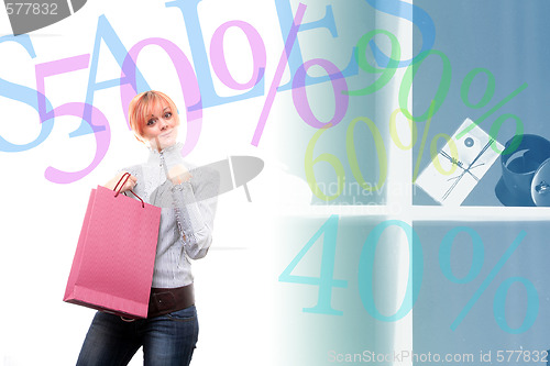 Image of happy young girl with colored bags