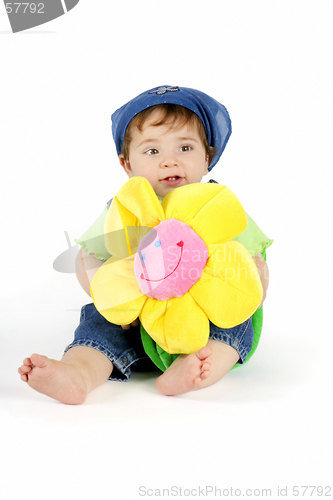 Image of Baby girl with yellow flower