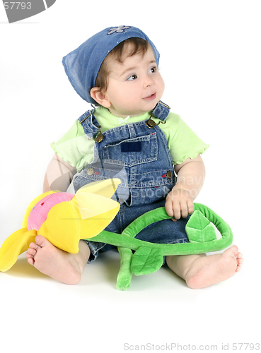 Image of Baby girl holding flower