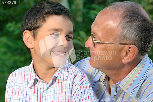 Image of grandfather and kid outdoors