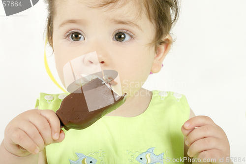 Image of Baby girl eating an ice cream mini