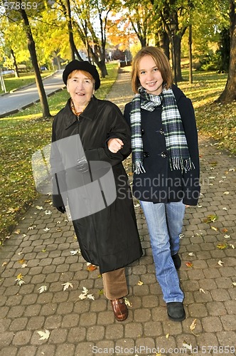 Image of Granddaughter walking with grandmother