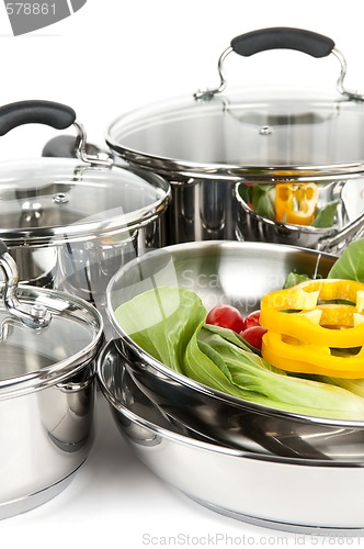 Image of Stainless steel pots and pans with vegetables