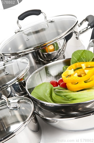 Image of Stainless steel pots and pans with vegetables