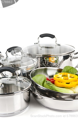 Image of Stainless steel pots and pans with vegetables