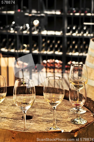 Image of Wine  glasses and barrels