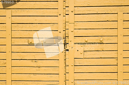 Image of yellow wooden gates 