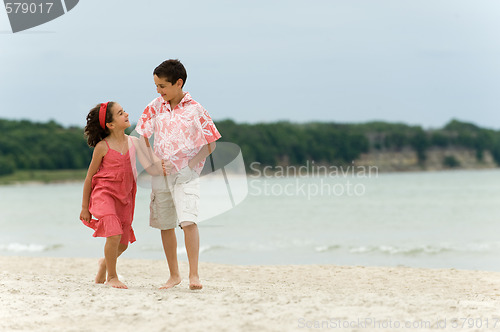 Image of Kids walking on the beach