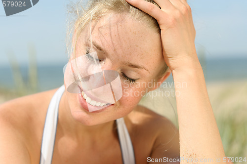 Image of Portrait of beautiful female on the beach