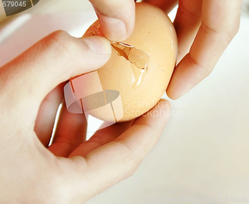 Image of Egg breaking