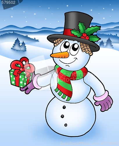 Image of Christmas snowman in snowy landscape