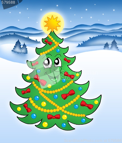 Image of Cute Christmas tree in snowy landscape