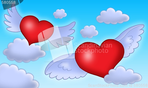 Image of hearts with wings on blue sky.