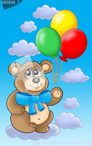 Image of Teddy bear with color balloons on blue sky.