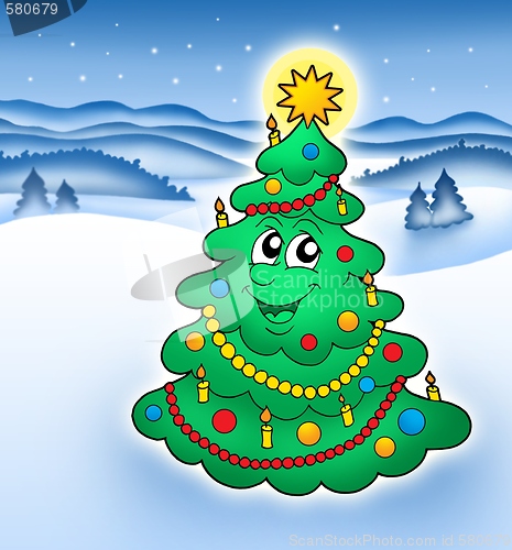Image of Smiling Christmas tree in snowy landscape