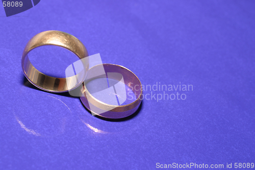 Image of Wedding rings over blue