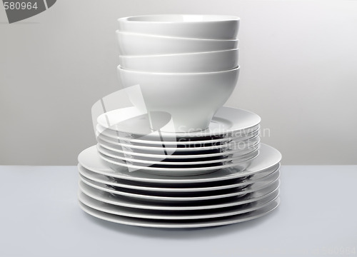 Image of Classic white dishes against neutral simple background