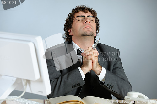 Image of praying businessman