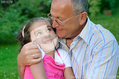 Image of grandfather and kid outdoors