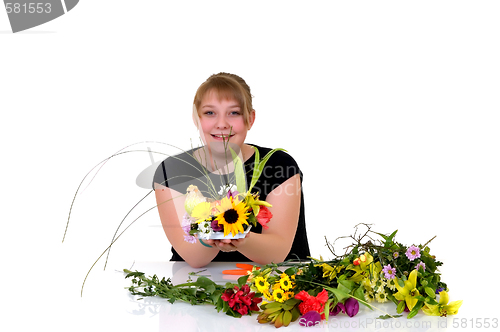 Image of Young girl arranging flowers 