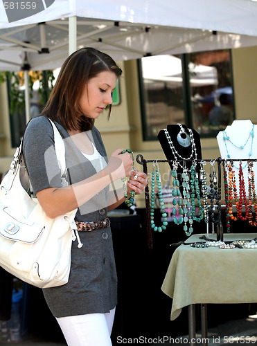 Image of Girl buying jewelry