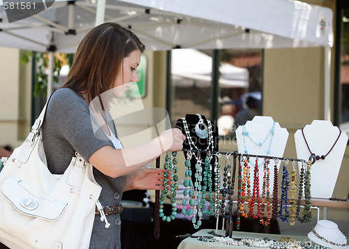 Image of Girl buying jewelry