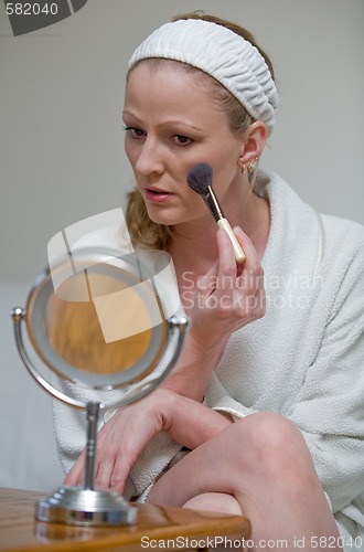 Image of Putting on makeup