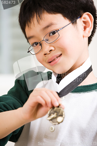 Image of Winning boy with his medal