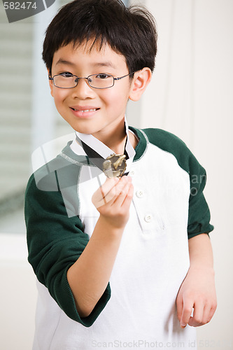 Image of Winning boy with his medal