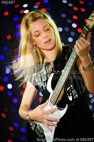 Image of Female guitar player