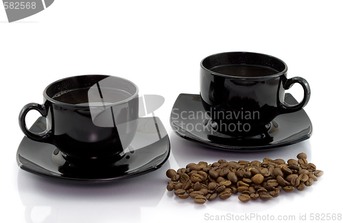 Image of Two cups and coffee beens