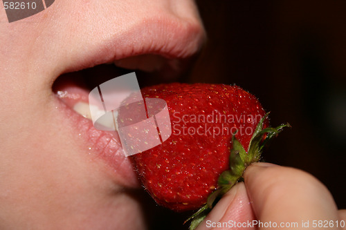Image of Mouth eat big mature strawberry