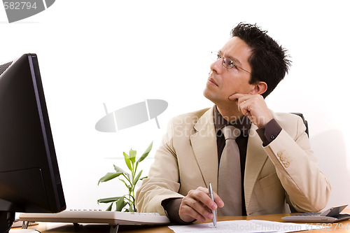 Image of businessman working at his office 