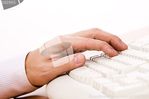Image of hand typing in a keyboard
